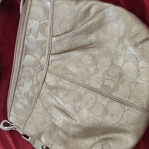 Its a Coach purse but not sure. No identifying numbers